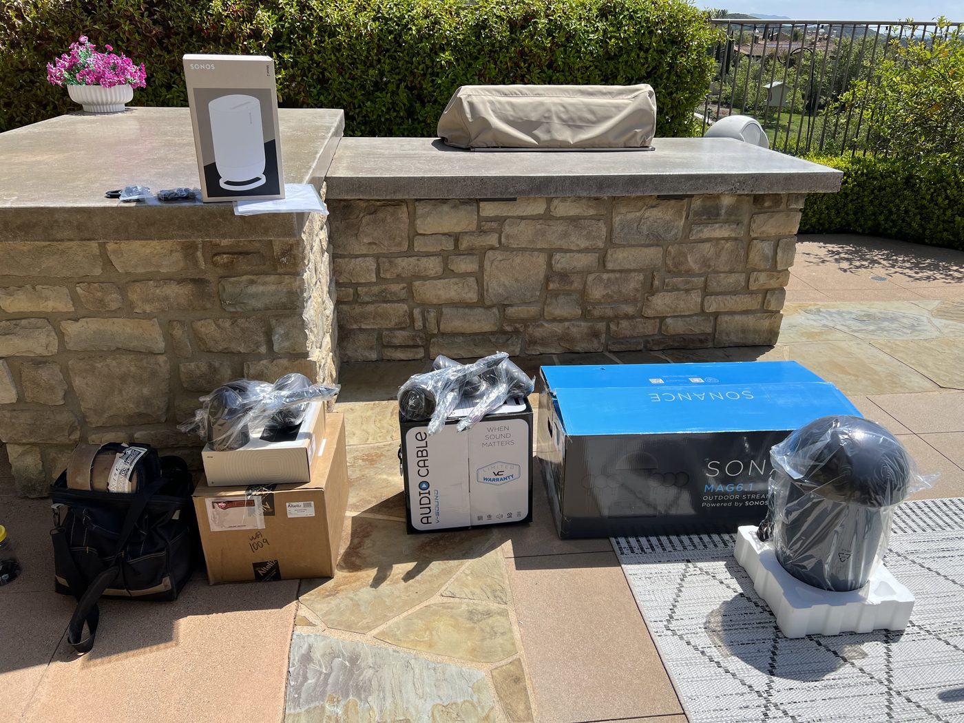 Sonos and outdoor speaker equipment staged for installation