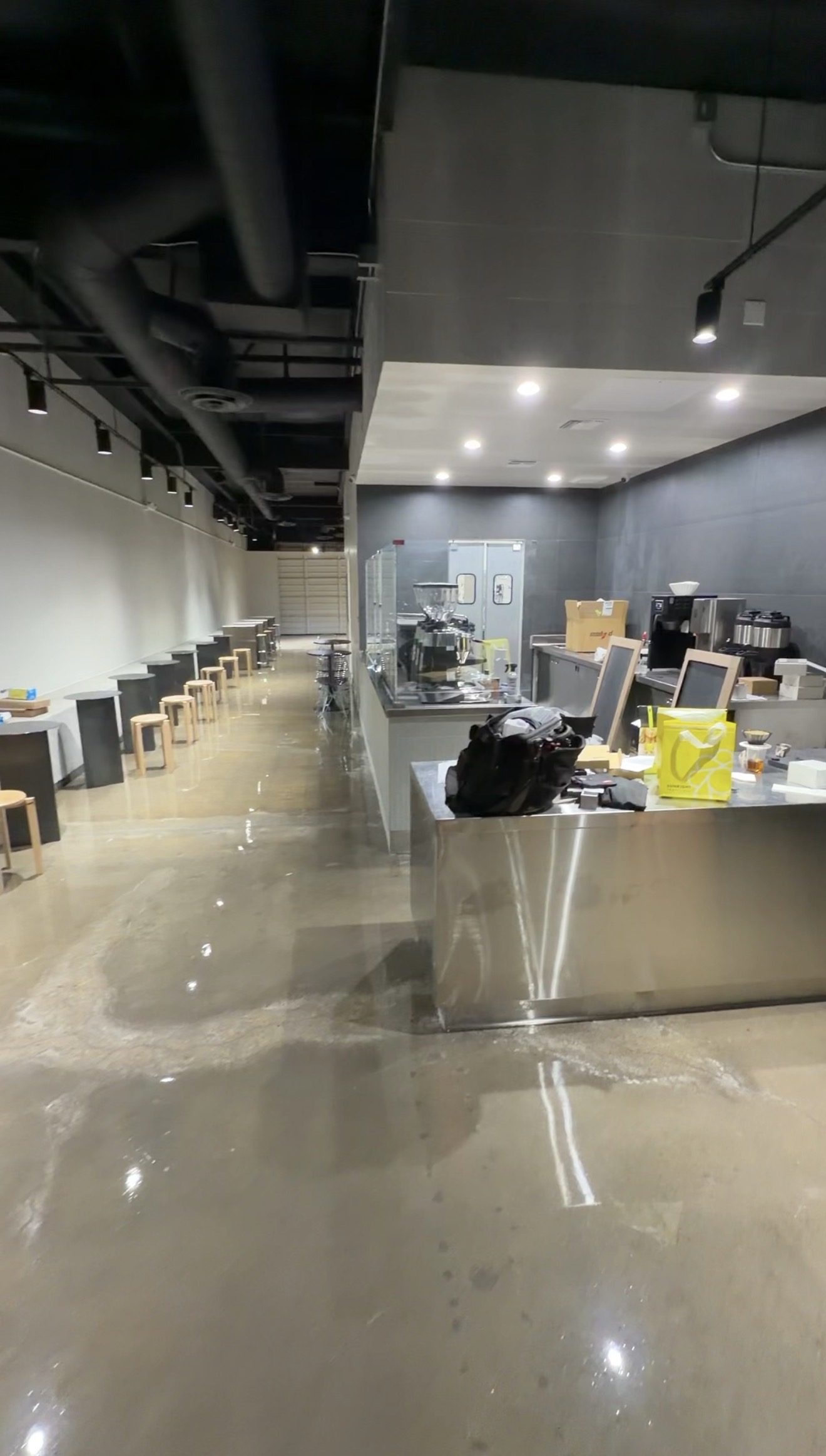 Coffee shop interior with seating and espresso bar during buildout