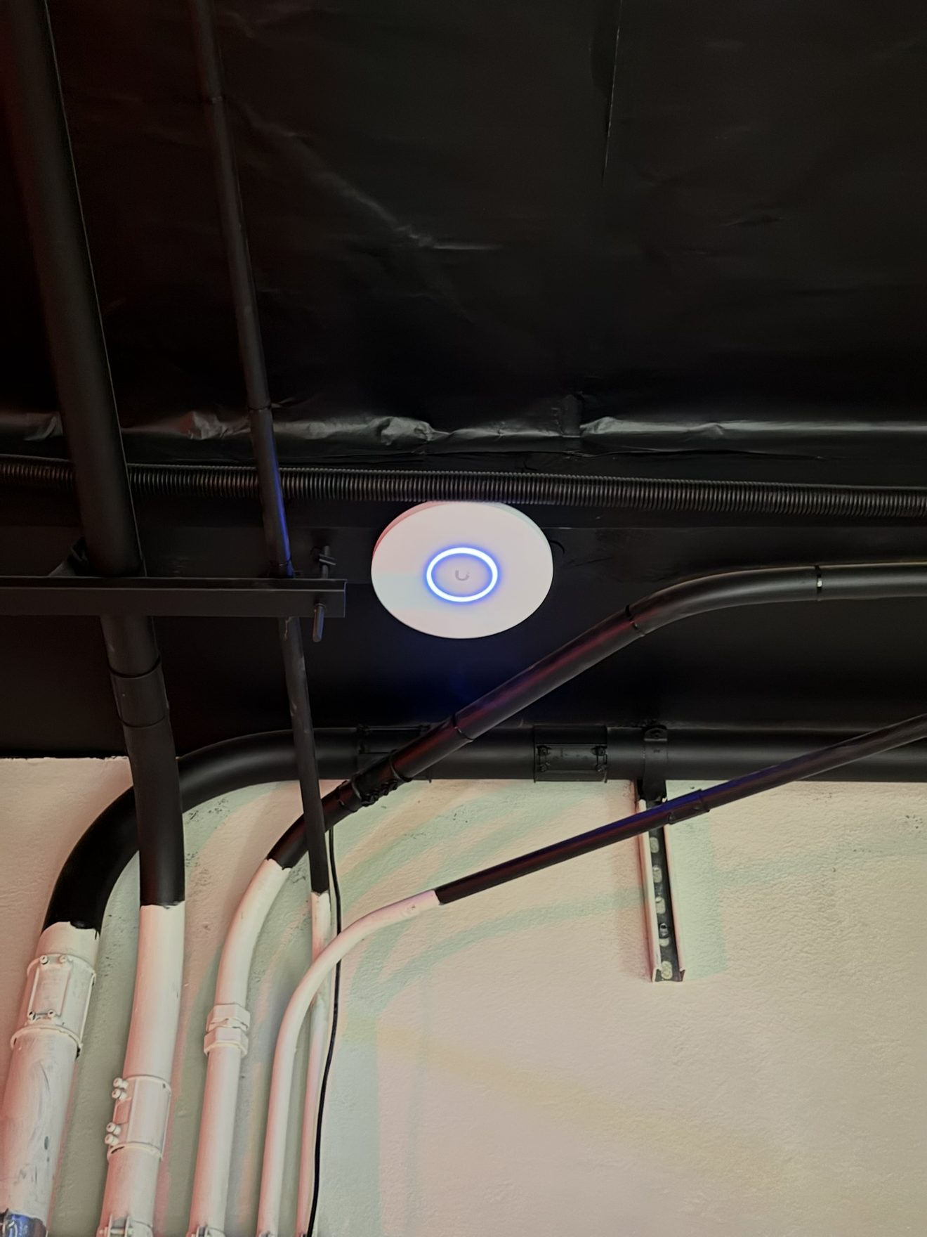 Wireless access point mounted in ceiling for WiFi coverage