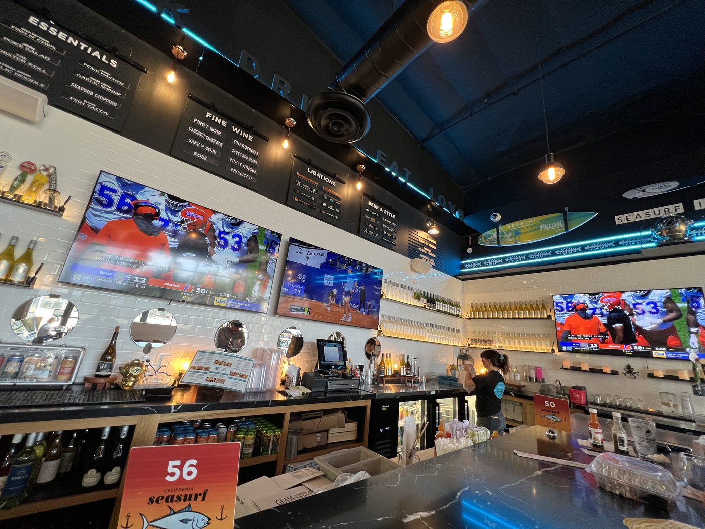 Restaurant bar with mounted displays and audio system