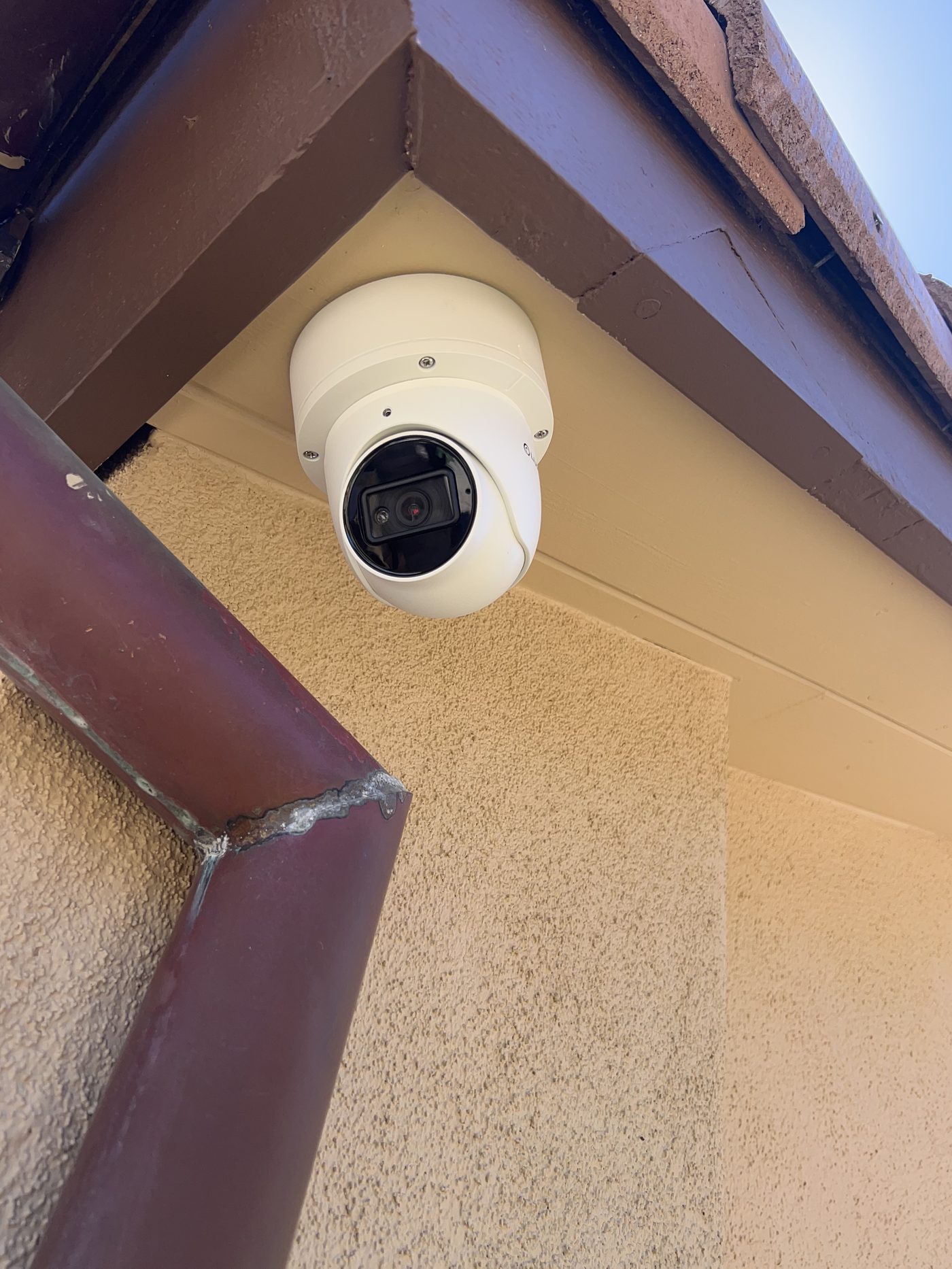 Security camera mounted under roof overhang